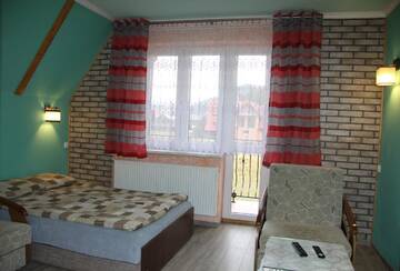 Фото номера Трехместный номер с балконом Проживание в семье Pokoje Gościnne г. Замок Нидзица 3
